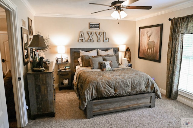 carpeted bedroom featuring ceiling fan and crown molding