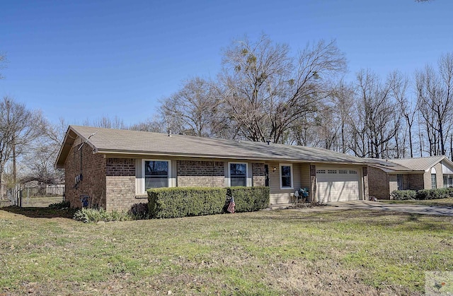 ranch-style house featuring driveway, a front lawn, fence, an attached garage, and brick siding