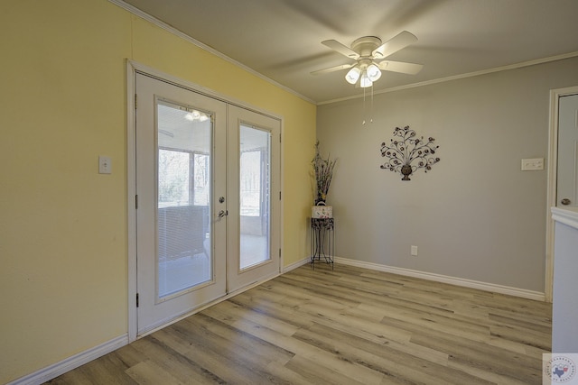 doorway to outside featuring crown molding, light wood-style flooring, french doors, and baseboards