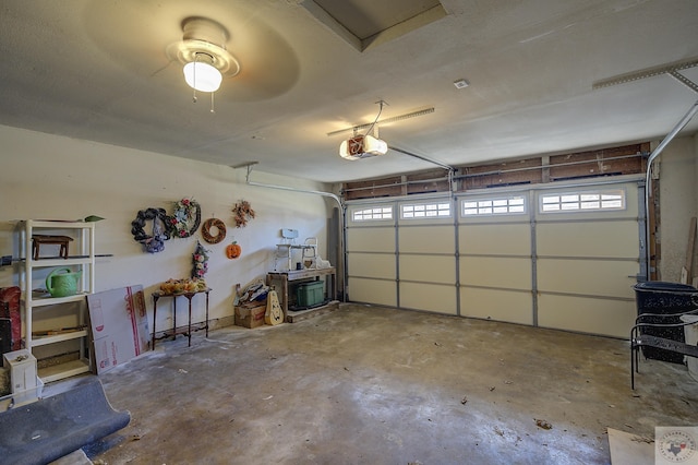 garage featuring a garage door opener