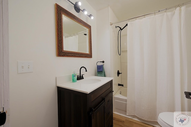 full bathroom with hardwood / wood-style flooring, toilet, vanity, and shower / bath combination with curtain