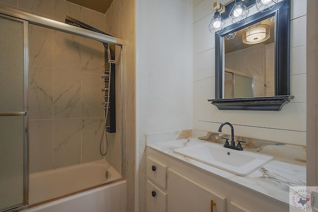 full bath with combined bath / shower with glass door and vanity