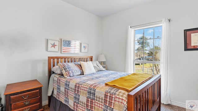 carpeted bedroom with baseboards