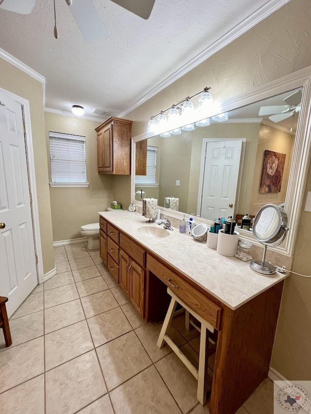 bathroom with tile patterned flooring, a ceiling fan, and crown molding