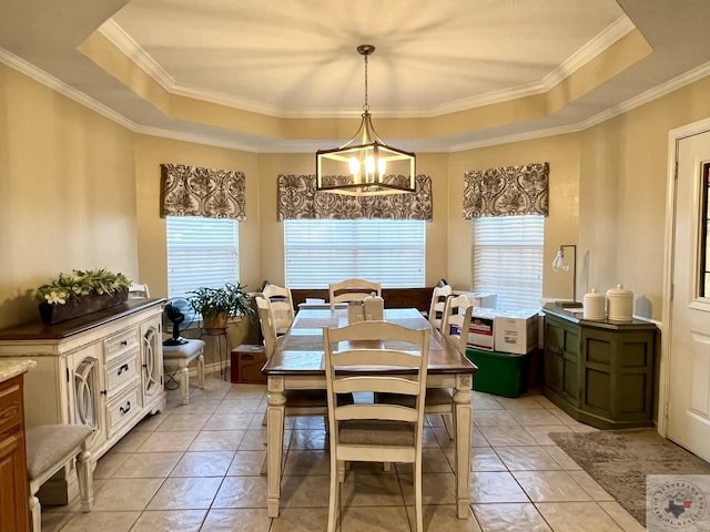 dining room featuring light tile patterned floors, a tray ceiling, and an inviting chandelier