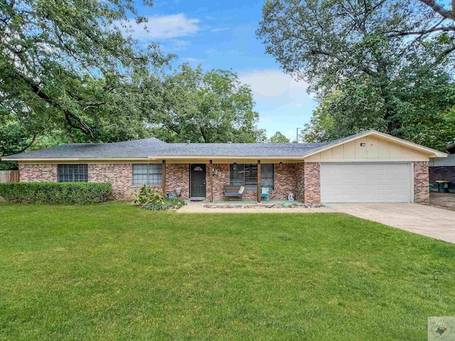 ranch-style house featuring a front yard and a garage