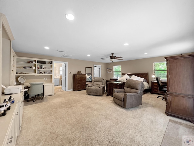 bedroom with light colored carpet and ceiling fan