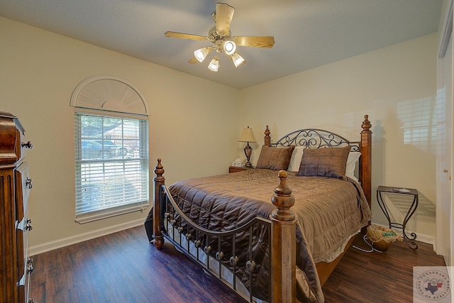 bedroom featuring ceiling fan and dark wood-type flooring