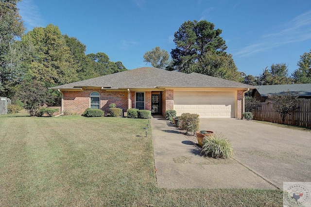 single story home featuring a garage and a front yard