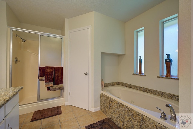 bathroom with tile patterned floors, vanity, and plus walk in shower