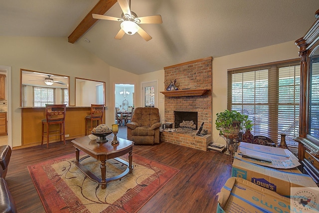 living room featuring a brick fireplace, dark wood-type flooring, a wealth of natural light, and vaulted ceiling with beams