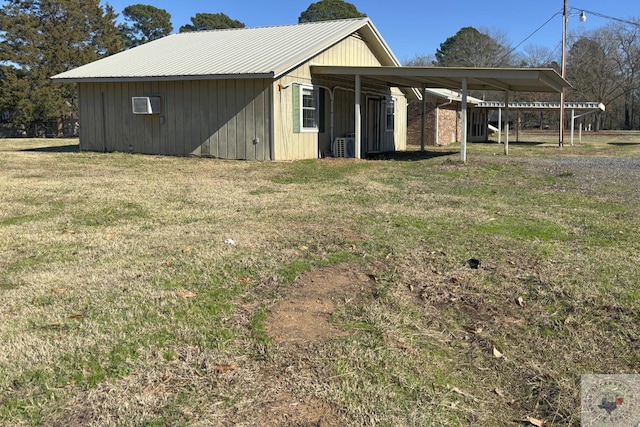 view of side of property with a yard