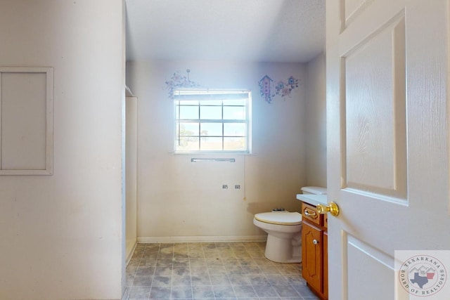 bathroom featuring toilet and vanity