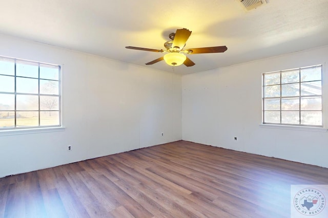 spare room featuring ceiling fan and hardwood / wood-style floors