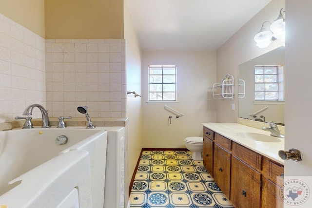 bathroom with toilet, vanity, a bathing tub, and tile patterned flooring