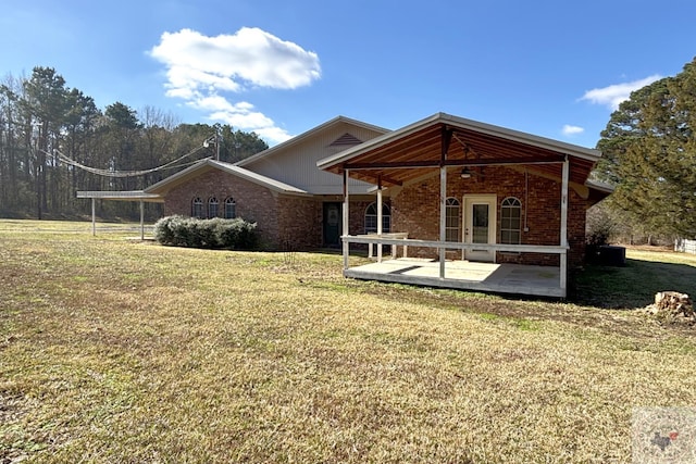 back of house featuring a yard