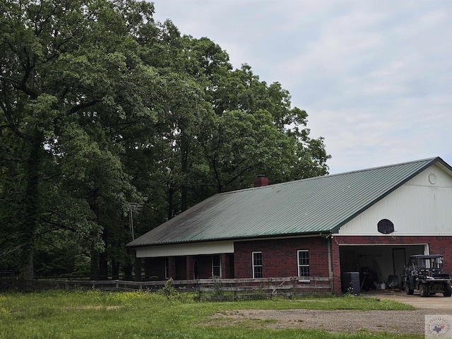 view of property exterior featuring an outdoor structure