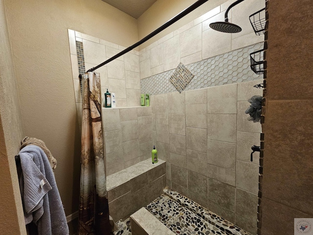 bathroom with a shower with shower curtain