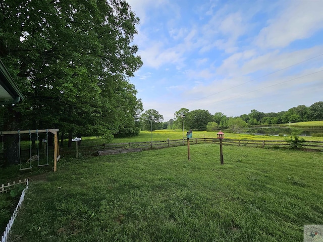 view of yard with a rural view