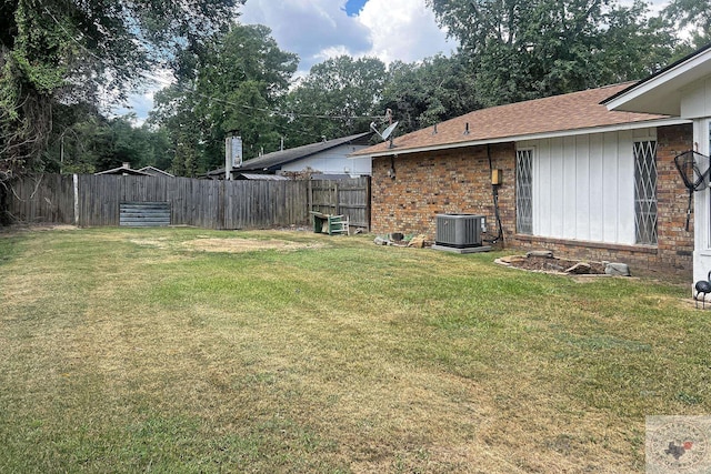 view of yard featuring central air condition unit