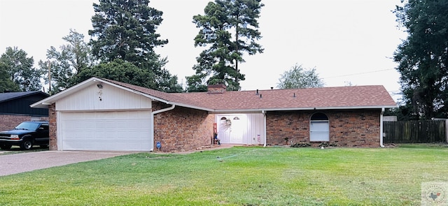 single story home featuring a garage and a front lawn