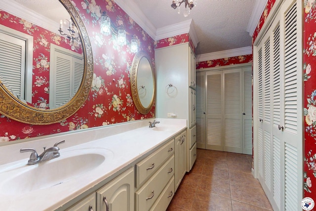 1315 Holloway Dr, Texarkana, TX 75503 - full bath with a closet, double vanity, ornamental molding, a textured ceiling, and tile patterned floors
