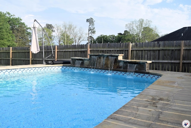 view of pool featuring a fenced in pool and fence