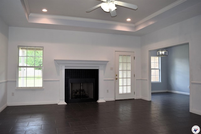 4802 David Dr, Texarkana, TX 75503 - unfurnished living room featuring ceiling fan, a raised ceiling, a fireplace, crown molding, and baseboards