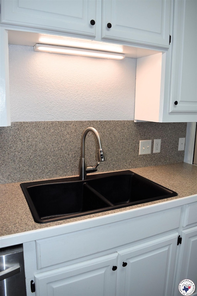 4802 David Dr, Texarkana, TX 75503 - kitchen featuring a sink, white cabinetry, dishwasher, and light countertops