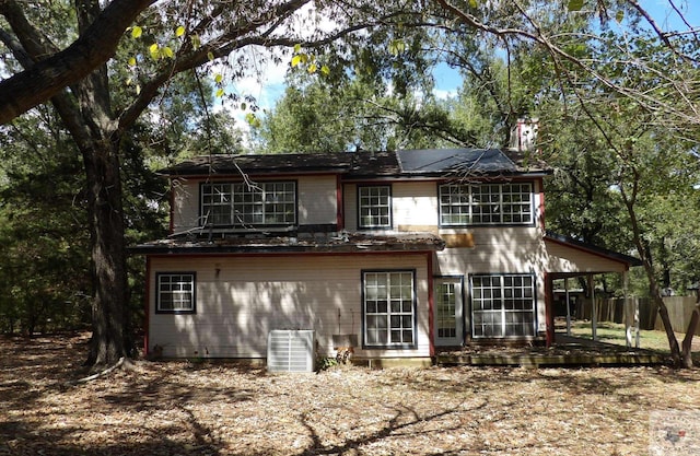 back of house featuring cooling unit