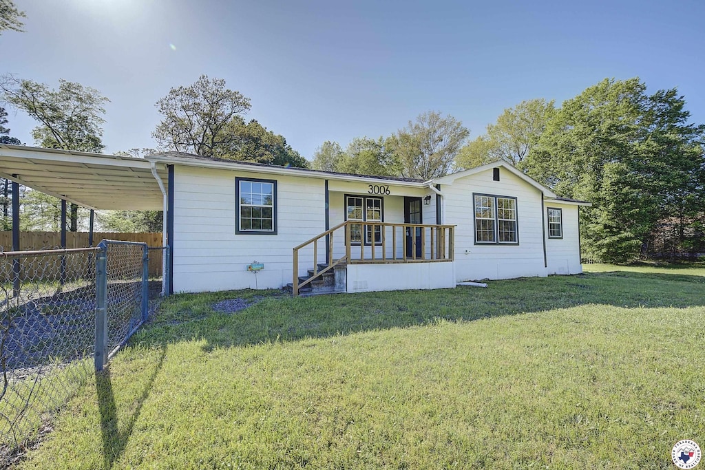 3006 Flower Acres, Texarkana, TX 75501 - view of front of home featuring a front yard and fence