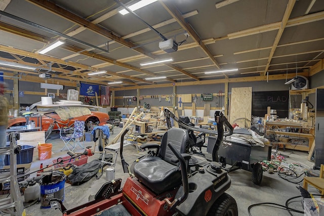 garage featuring a workshop area and a garage door opener