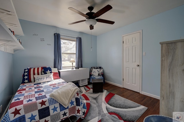 bedroom featuring dark wood-type flooring and ceiling fan