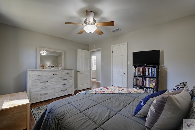 bedroom featuring dark wood-type flooring and ceiling fan