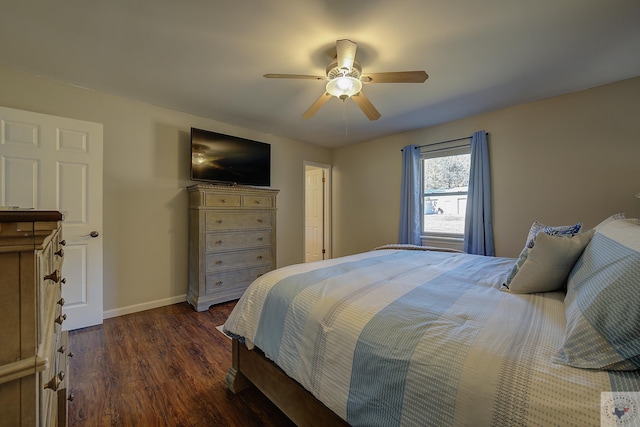 bedroom featuring ceiling fan and dark hardwood / wood-style flooring