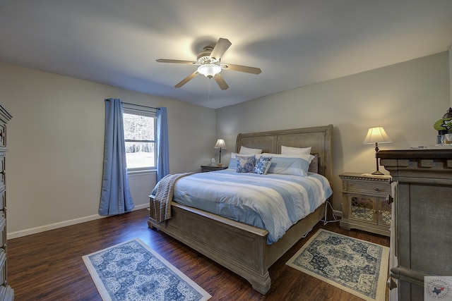 bedroom with ceiling fan and dark hardwood / wood-style flooring