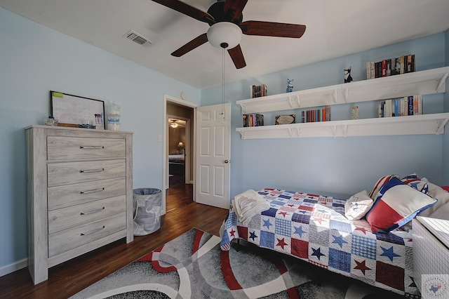 bedroom featuring ceiling fan and dark hardwood / wood-style flooring