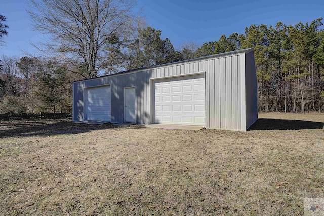 garage with a lawn