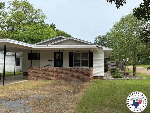 1112 Kirby St, Texarkana, AR 71854 - bungalow with a front yard, a carport, and crawl space