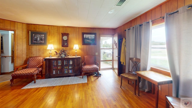 sitting room with a healthy amount of sunlight and light hardwood / wood-style flooring