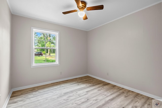 spare room with ornamental molding, ceiling fan, and light hardwood / wood-style flooring