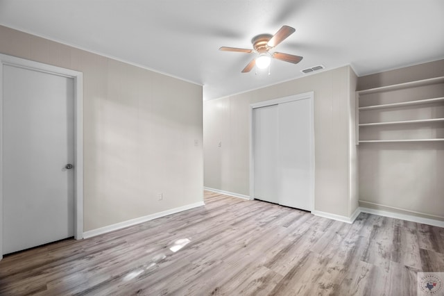 unfurnished bedroom featuring ceiling fan and light wood-type flooring