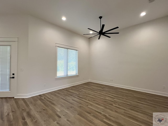 unfurnished room featuring ceiling fan and dark hardwood / wood-style floors