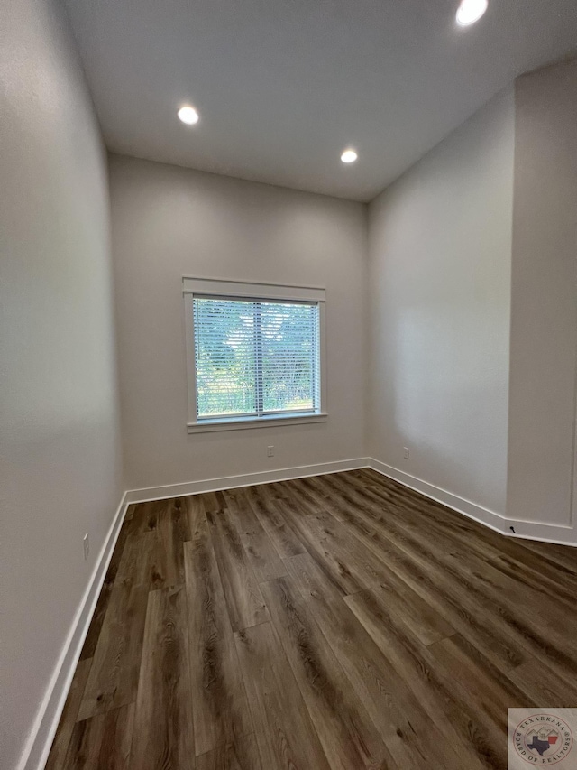 spare room featuring dark hardwood / wood-style flooring