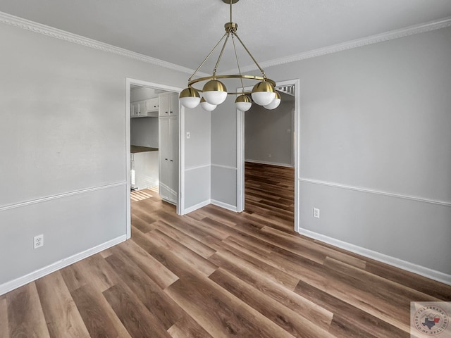 unfurnished dining area with crown molding and dark hardwood / wood-style floors