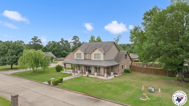 5710 Clearwood Trl, Texarkana, AR 71854 - view of front of home with a porch and a standing seam roof