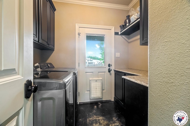 5710 Clearwood Trl, Texarkana, AR 71854 - laundry room with cabinet space, crown molding, and washing machine and clothes dryer