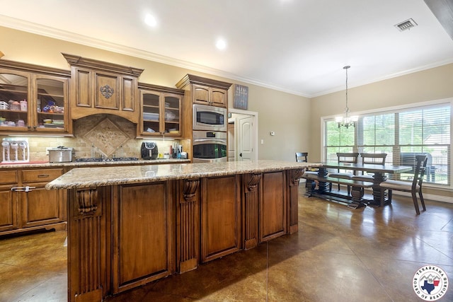 5710 Clearwood Trl, Texarkana, AR 71854 - kitchen featuring stainless steel appliances, backsplash, a center island, a chandelier, and glass insert cabinets