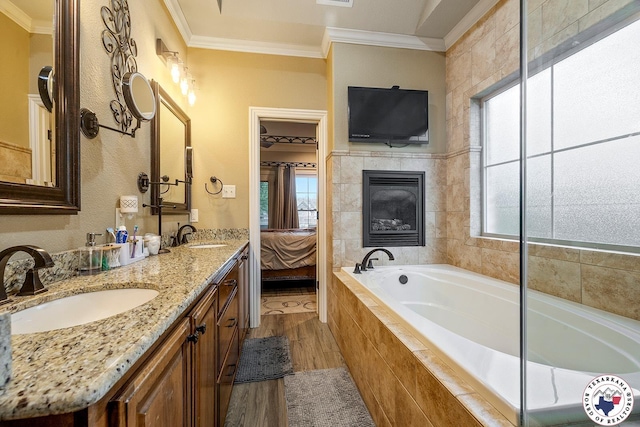 5710 Clearwood Trl, Texarkana, AR 71854 - full bathroom with crown molding, wood finished floors, healthy amount of natural light, a bath, and connected bathroom