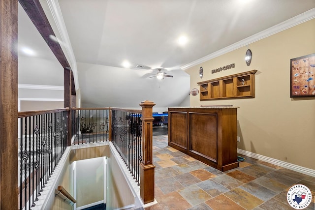 5710 Clearwood Trl, Texarkana, AR 71854 - bar with ceiling fan, baseboards, crown molding, and stone tile flooring